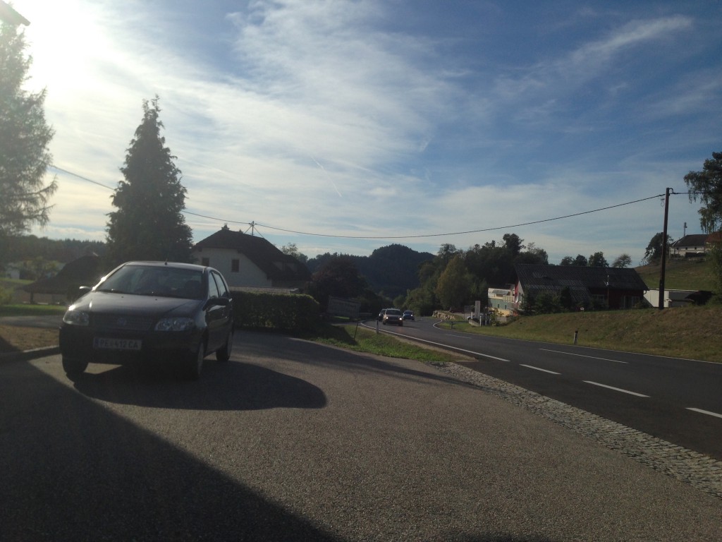 Picture 3: Car, road, cars in the distance.