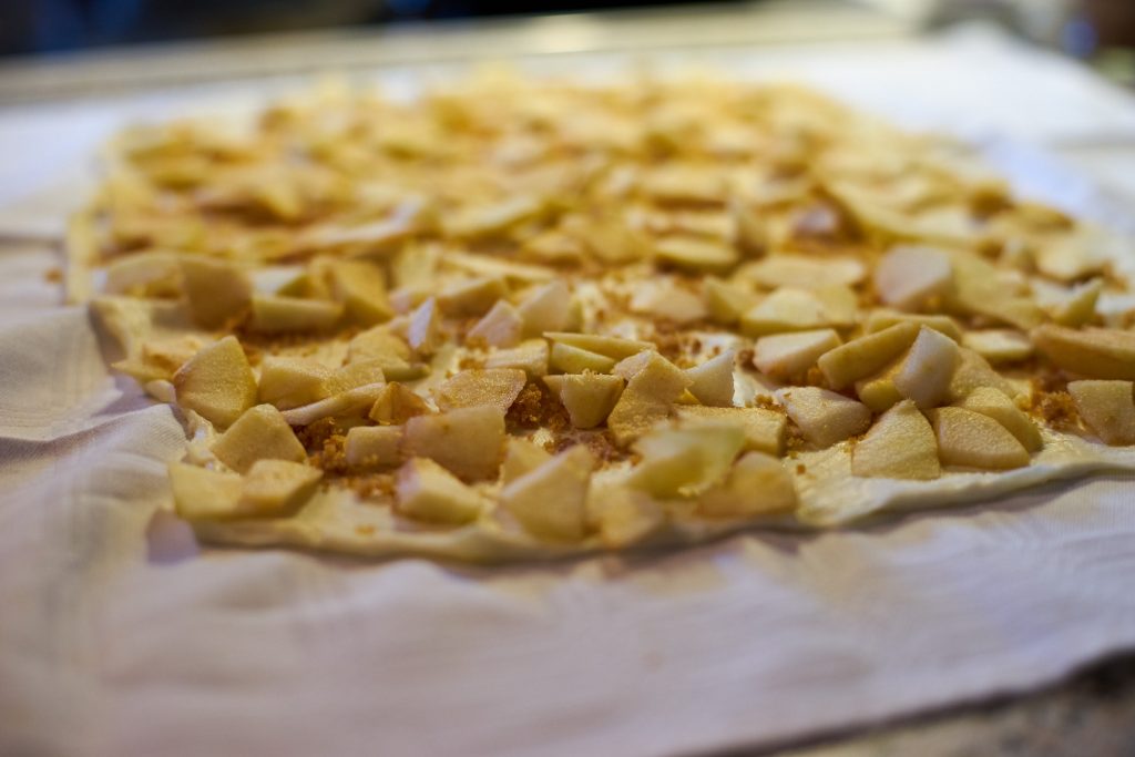 Apples distributed on the dough