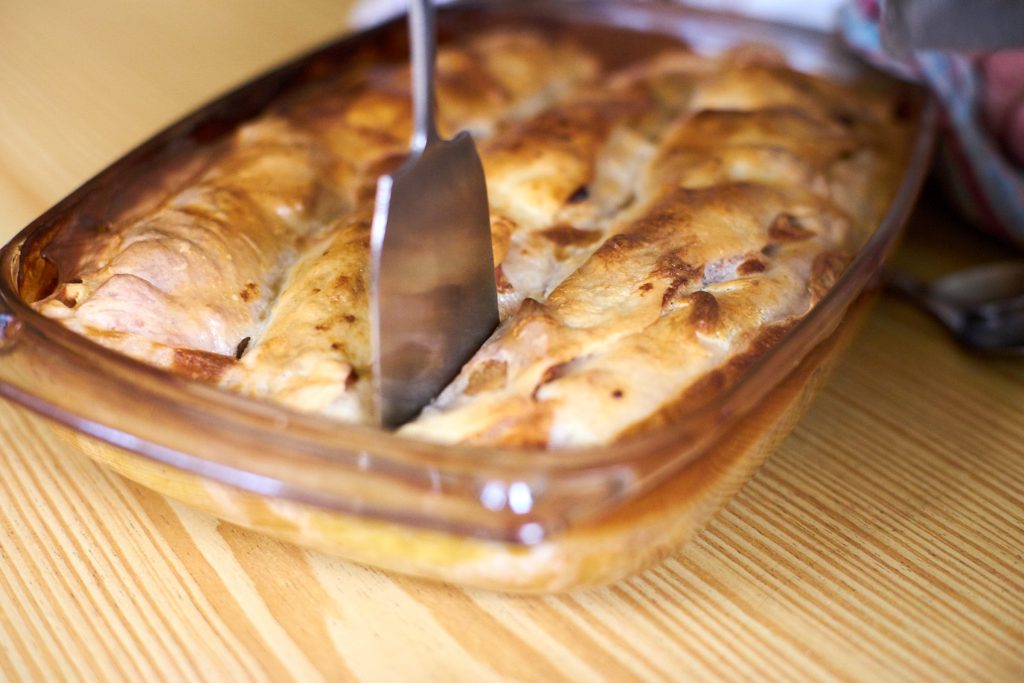 Apfelstrudel (apple strudel) in a baking dish.