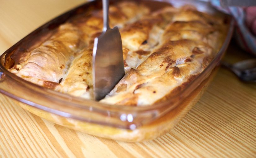 Apfelstrudel (apple strudel) in a baking dish.